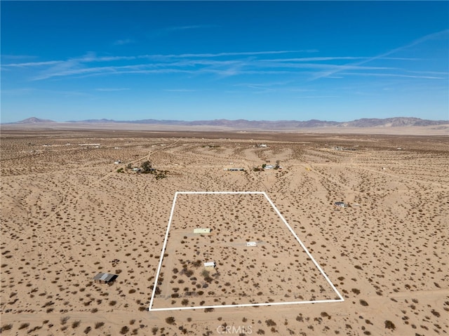 drone / aerial view featuring a mountain view