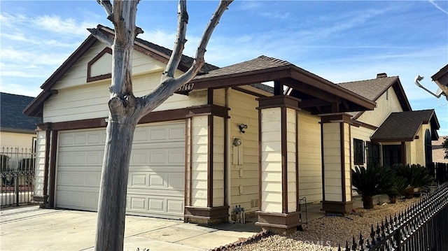 view of side of home with a garage