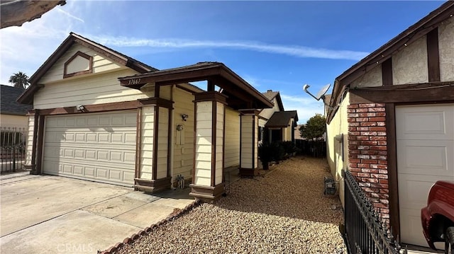 view of side of home with a garage