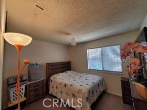 bedroom featuring a textured ceiling