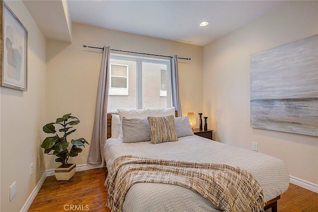 bedroom featuring dark hardwood / wood-style floors