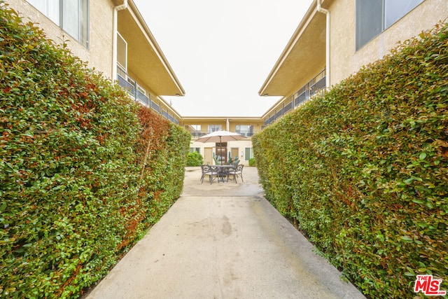 view of property's community with a patio