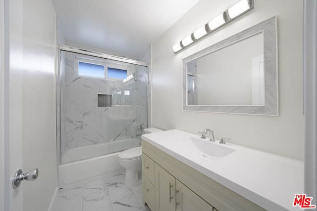 full bathroom with toilet, bath / shower combo with glass door, and vanity