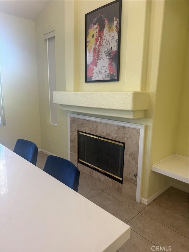 interior space featuring a tiled fireplace