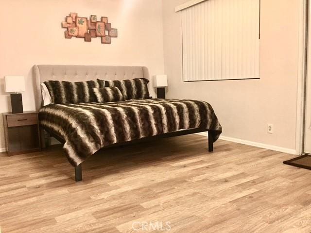 bedroom with light hardwood / wood-style floors