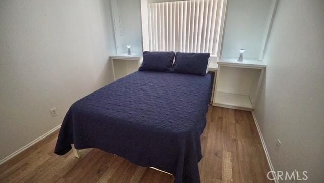 bedroom featuring hardwood / wood-style flooring