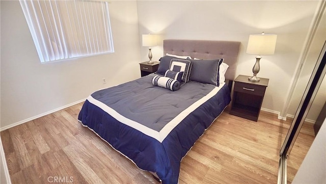 bedroom with light wood-type flooring