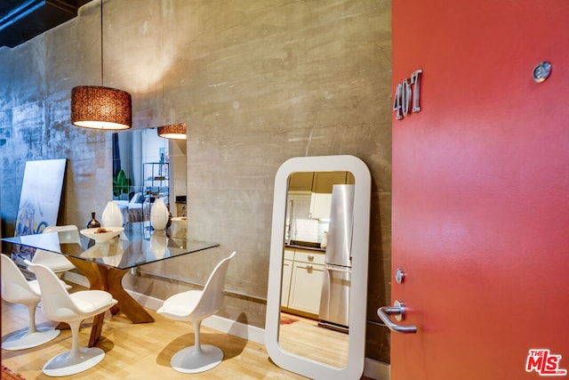 dining area with light wood-type flooring