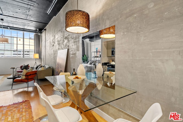 dining area with hardwood / wood-style flooring