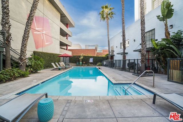 view of pool featuring a patio area