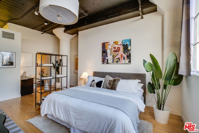 bedroom with light hardwood / wood-style flooring