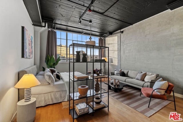 bedroom with wood-type flooring