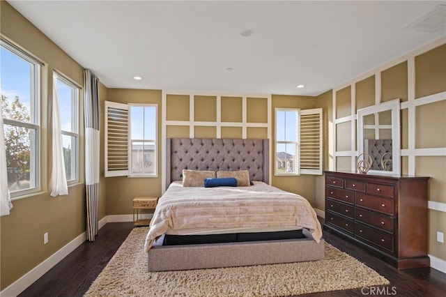 bedroom with dark wood-type flooring