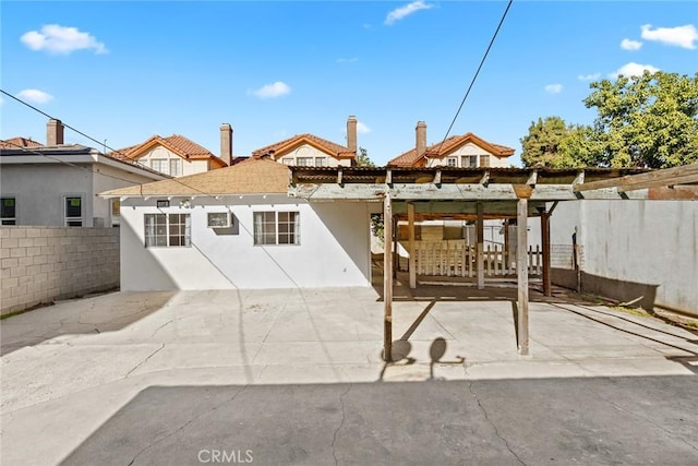 rear view of property featuring a patio