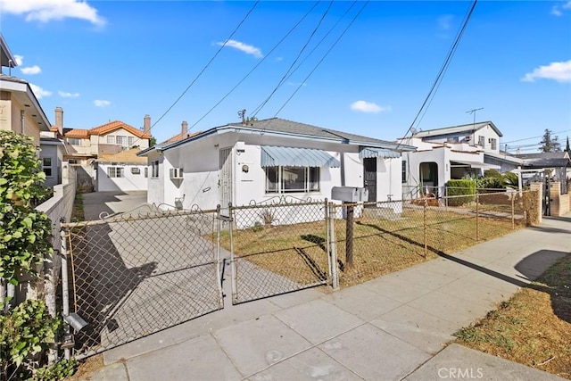 bungalow-style home featuring a front yard