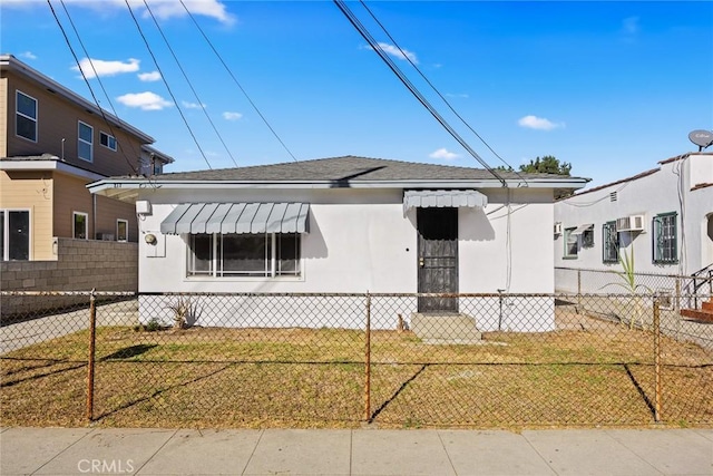 bungalow-style house with a front yard