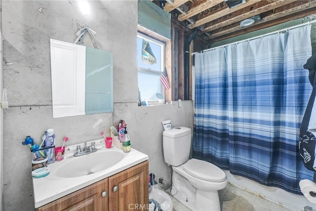 bathroom featuring toilet and vanity