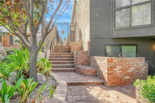 exterior space featuring brick siding