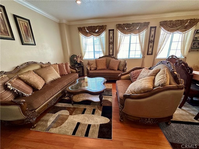 living room featuring hardwood / wood-style flooring and crown molding