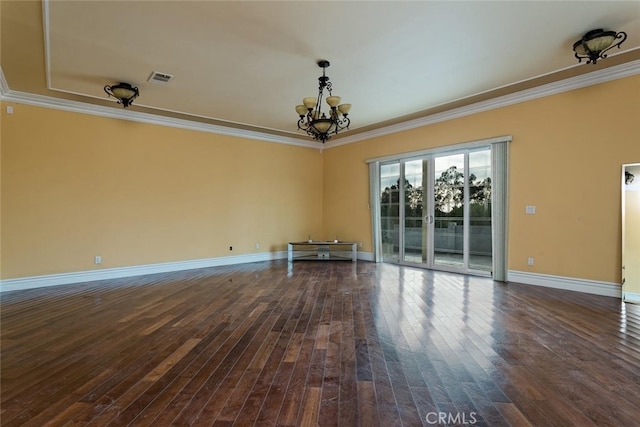 unfurnished room with dark wood-type flooring, ornamental molding, and a chandelier