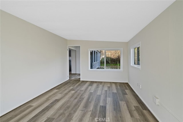 unfurnished room featuring hardwood / wood-style flooring