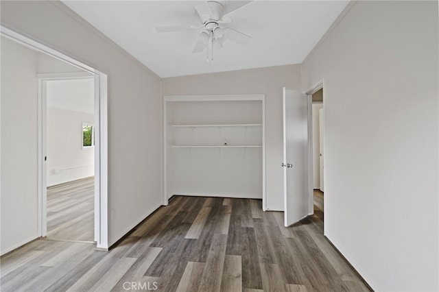 hallway with dark hardwood / wood-style flooring