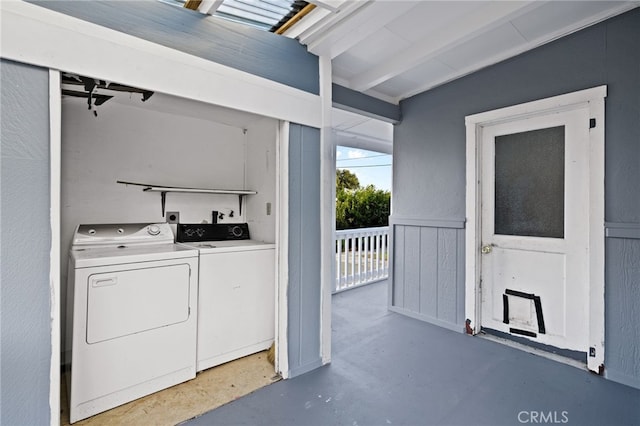 clothes washing area with washer and dryer