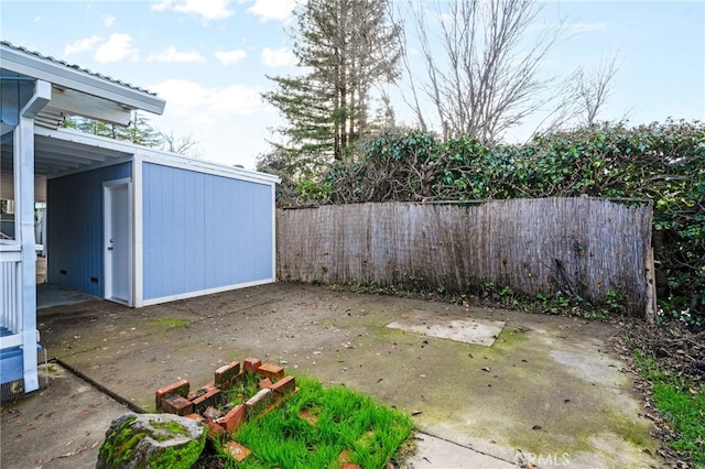 view of patio / terrace with a storage shed