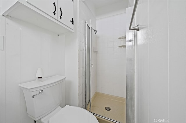 bathroom with an enclosed shower and toilet