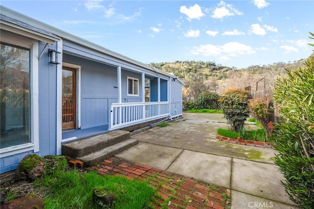 exterior space with covered porch and a patio area