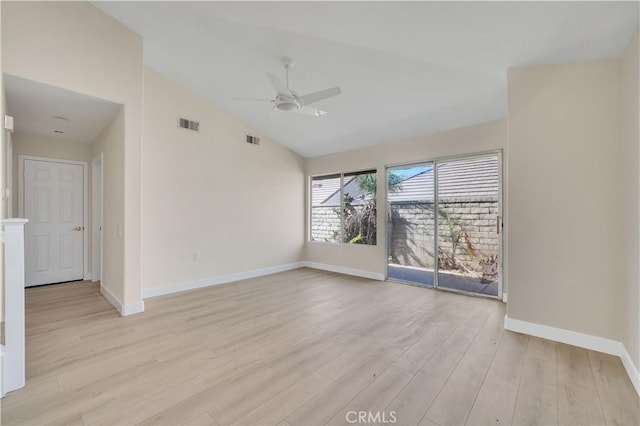 unfurnished room featuring ceiling fan, light wood-type flooring, and vaulted ceiling