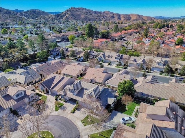 birds eye view of property featuring a mountain view