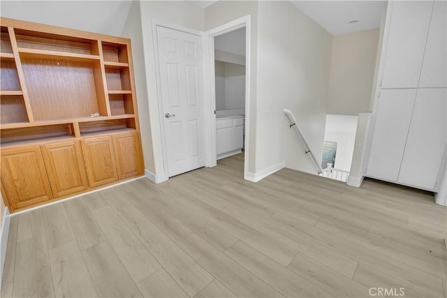 unfurnished living room featuring light wood-type flooring