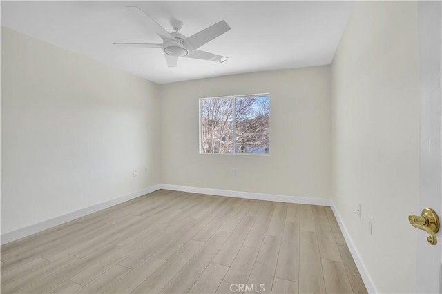 spare room featuring ceiling fan and light hardwood / wood-style floors