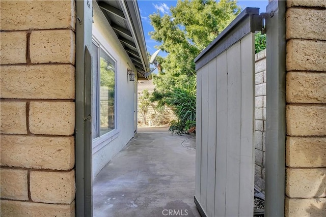 view of side of home featuring a patio