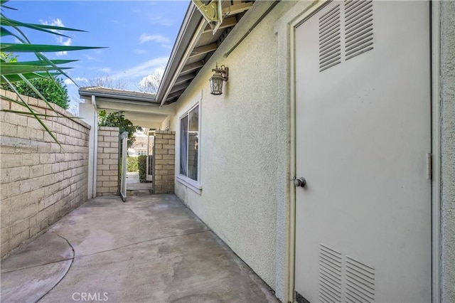 view of property exterior with a patio