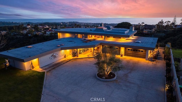 view of front of house with a water view