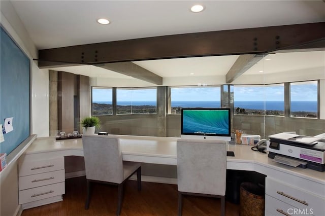 office area with dark hardwood / wood-style flooring, beam ceiling, and built in desk