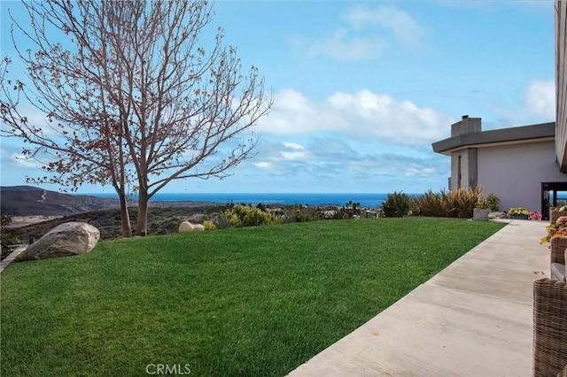 view of yard with a water view