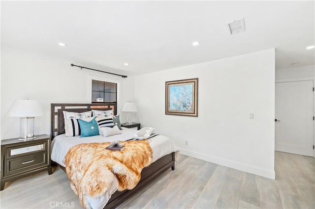 bedroom with light hardwood / wood-style flooring