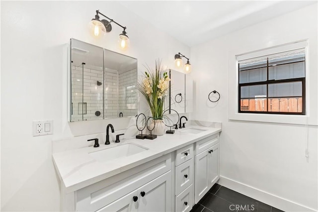 bathroom with vanity, tile patterned flooring, and an enclosed shower