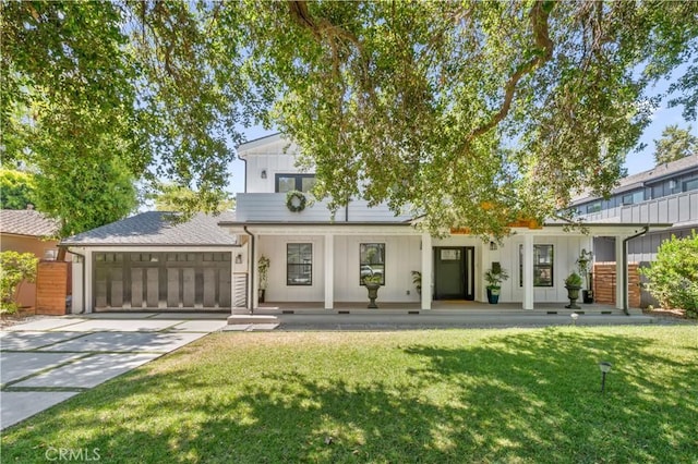 view of front of property with a front lawn and a garage