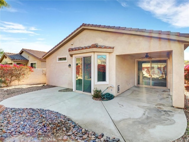 back of house featuring ceiling fan and a patio