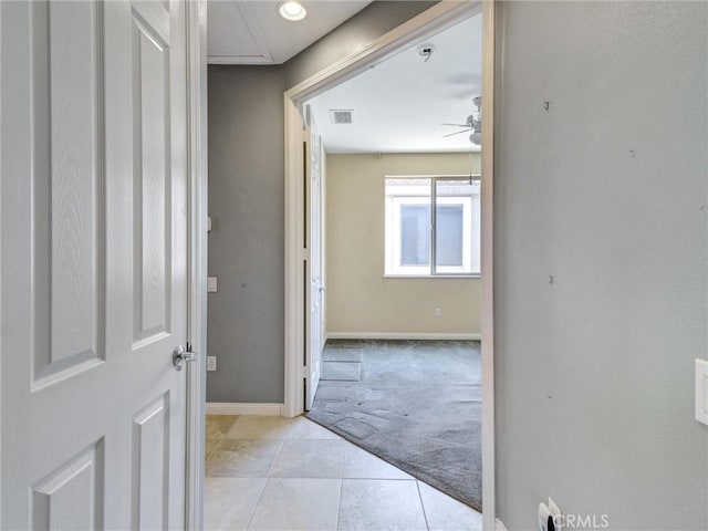 hallway featuring light carpet