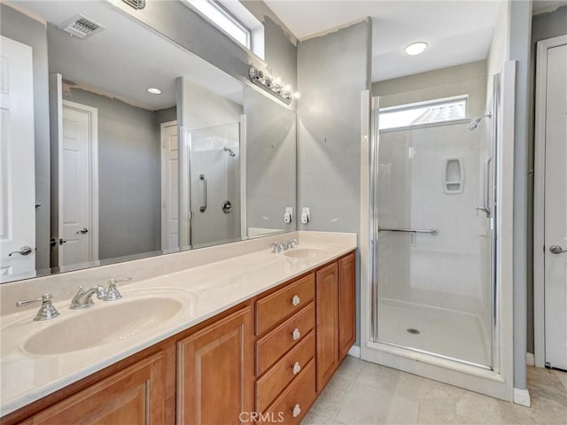 bathroom featuring an enclosed shower and vanity