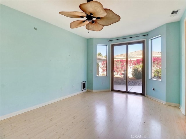 unfurnished room featuring ceiling fan and light hardwood / wood-style floors