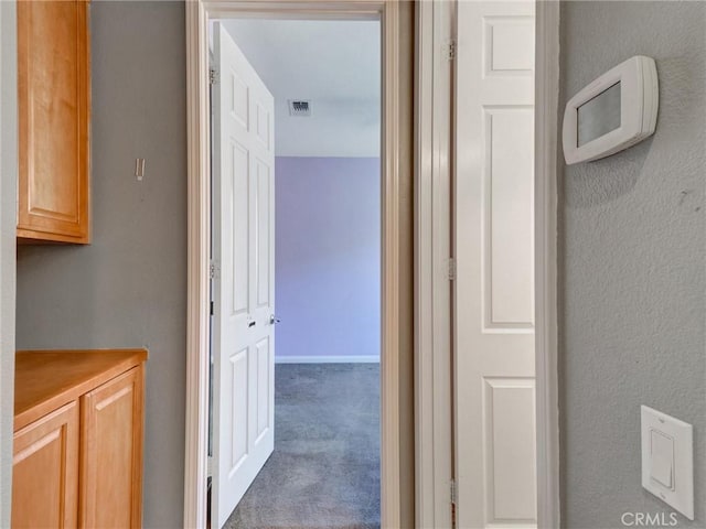 corridor with carpet floors