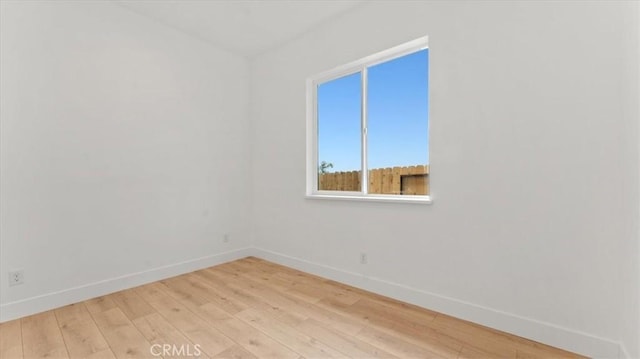 spare room featuring light hardwood / wood-style floors