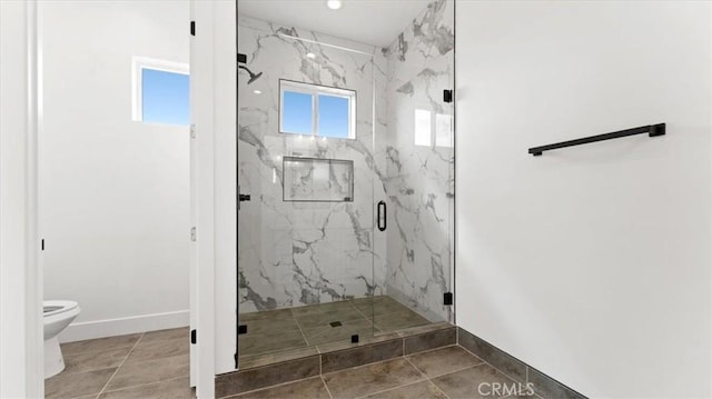 bathroom featuring toilet, tile patterned floors, and walk in shower