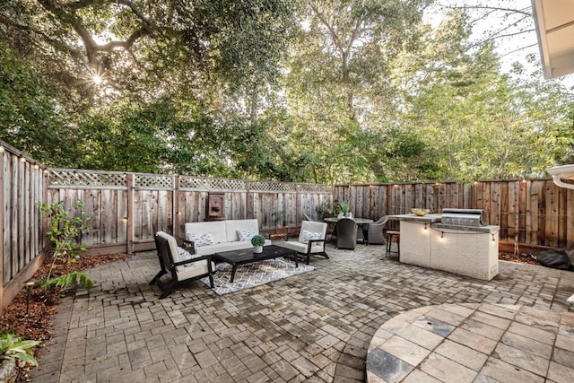 view of patio / terrace featuring grilling area and an outdoor hangout area